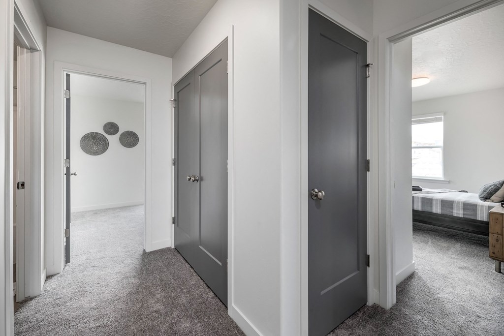 a row of closets with different doors on them in a room