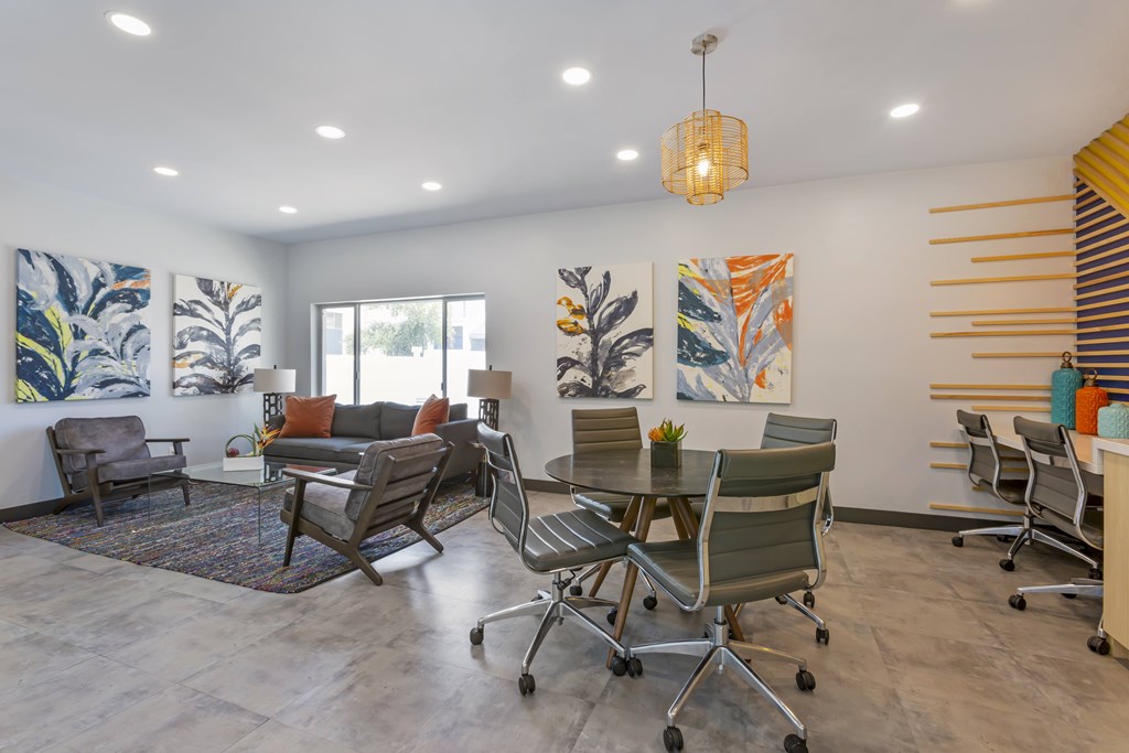 A modern office space with a grey floor and white walls.