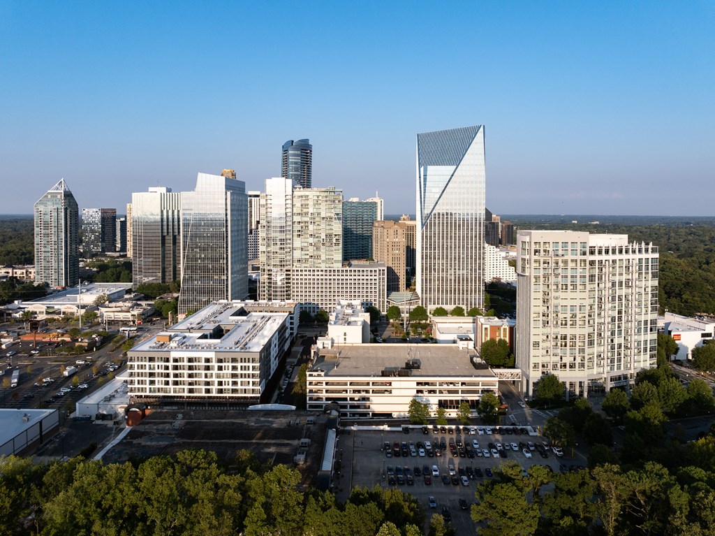 an aerial view of a city skyline with tall buildings and skyscrapers