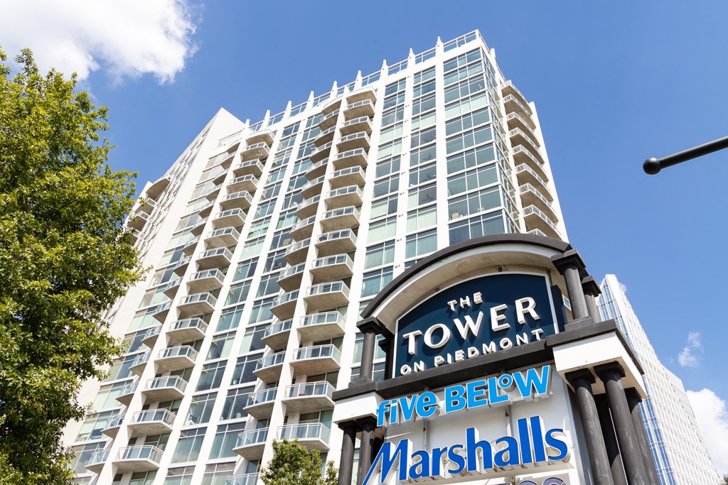 a tall building with a sign in front of it