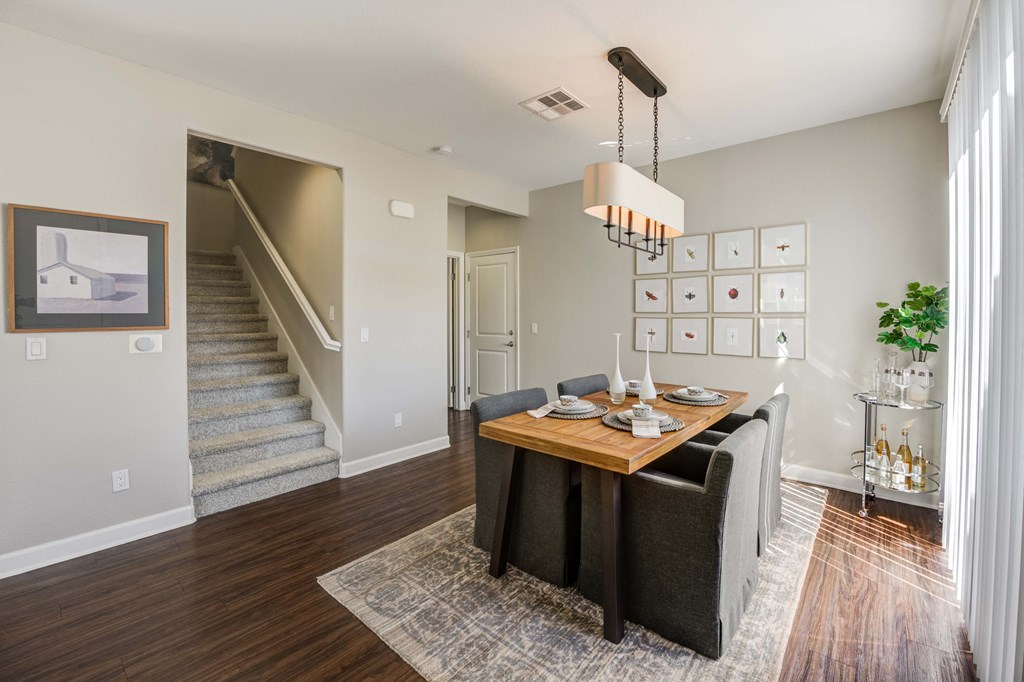 a dining room with a table and chairs