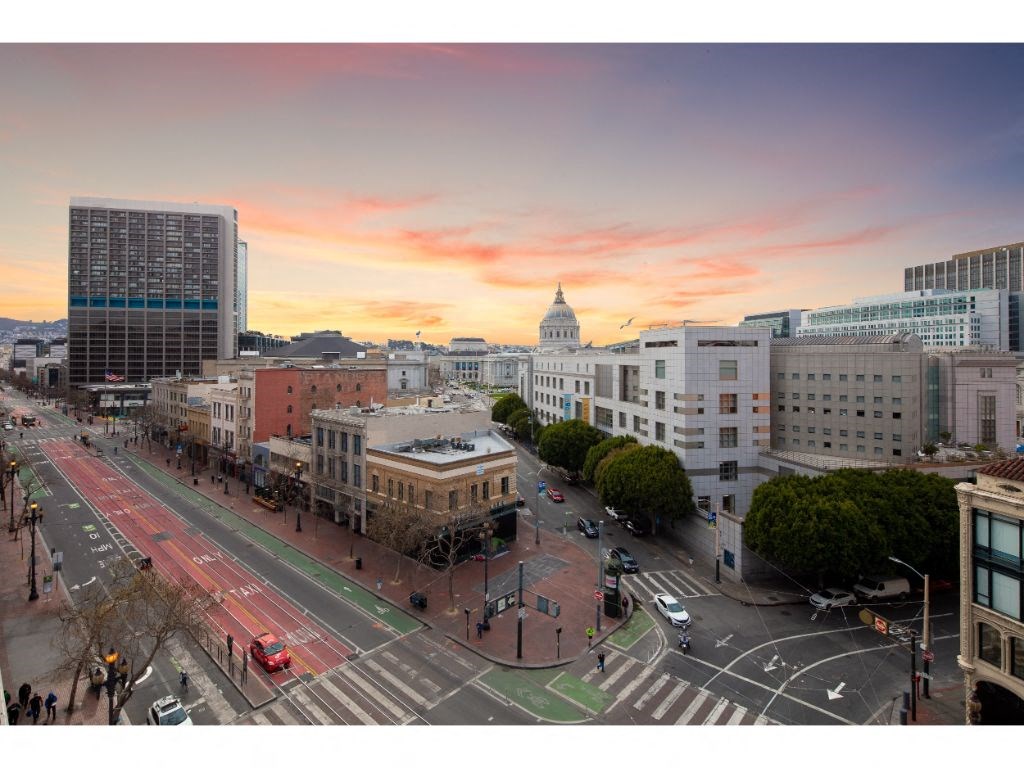 an aerial view of the city of san francisco with the capitol building in the background