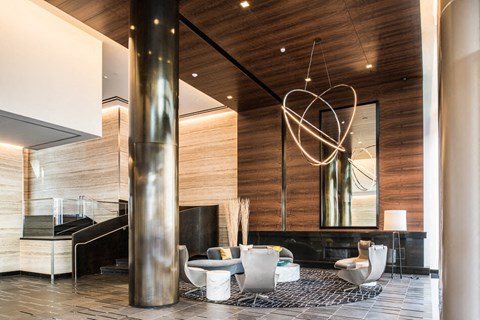 a modern hotel lobby with a large heart chandelier in the middle of the room