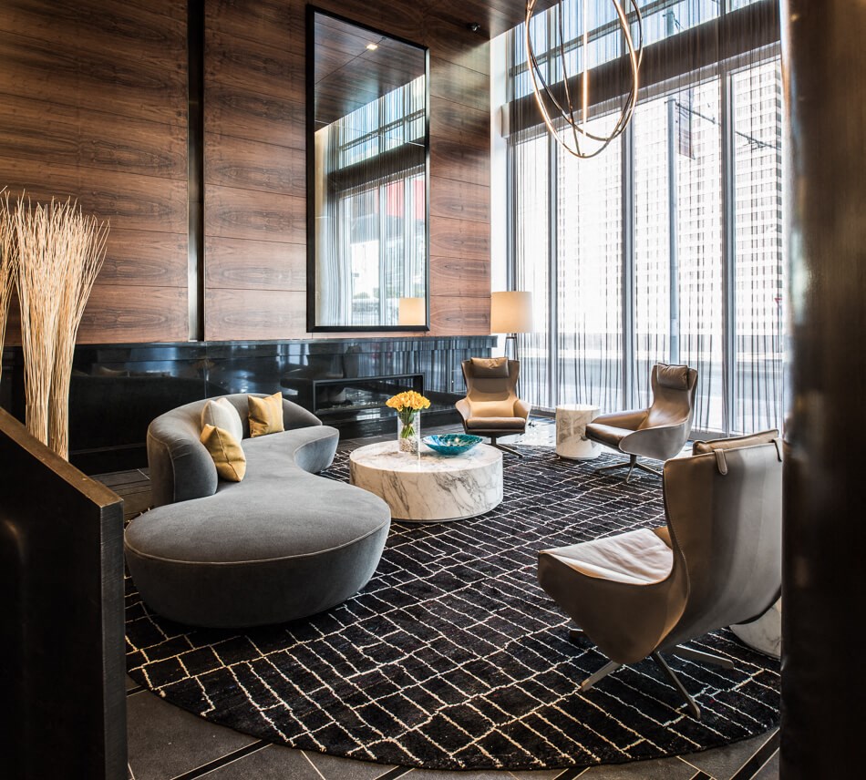 a living room filled with furniture and a large window