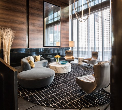 a living room filled with furniture and a large window