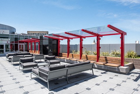 a rendering of the rooftop seating area on the second floor of the building