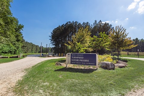 A sign for a turnipseed nature preserve in Wake County.