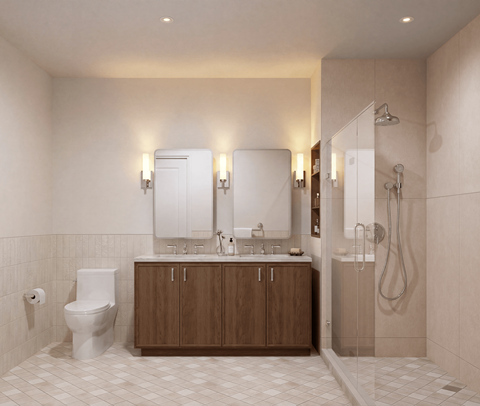 A bathroom with a toilet, sink, and mirror.