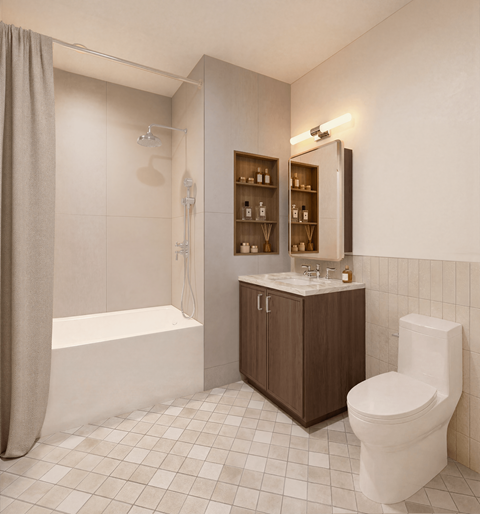 A white toilet sits next to a white bathtub in a bathroom.