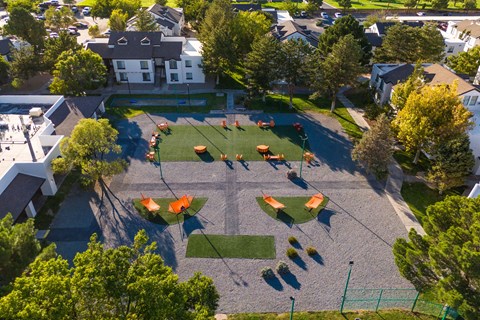 an aerial view of a playground in a neighborhood with trees