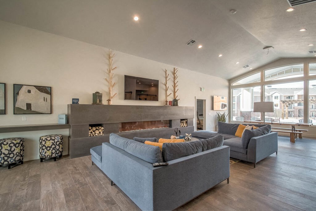 lounge area with fireplace and television