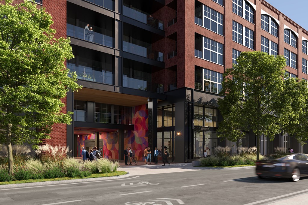 A red building with a large mural on the front.