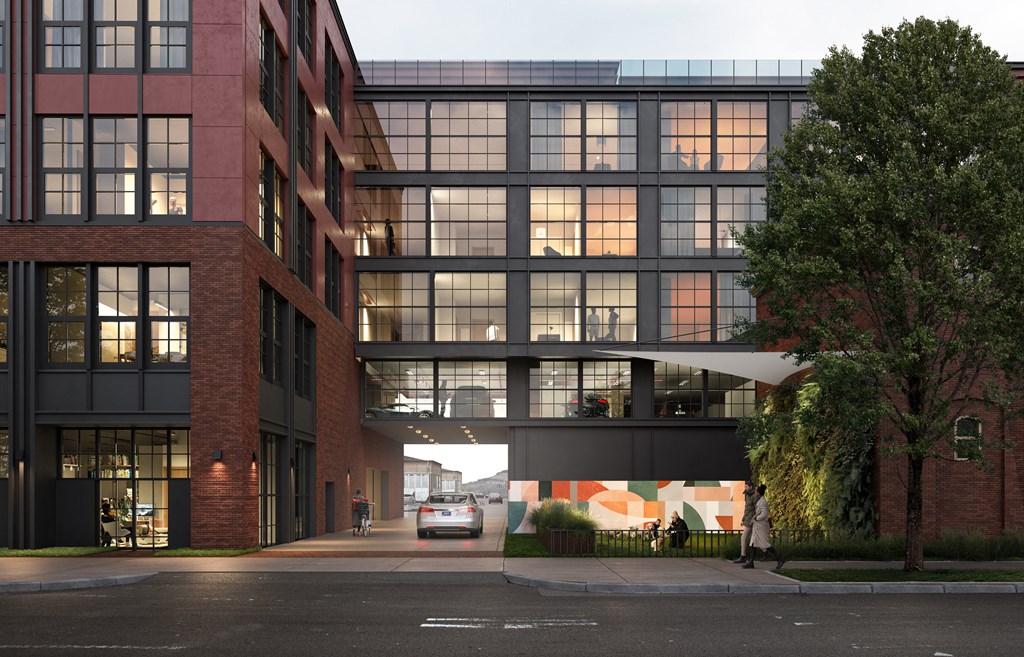 A modern building with a glass facade and a brick exterior.