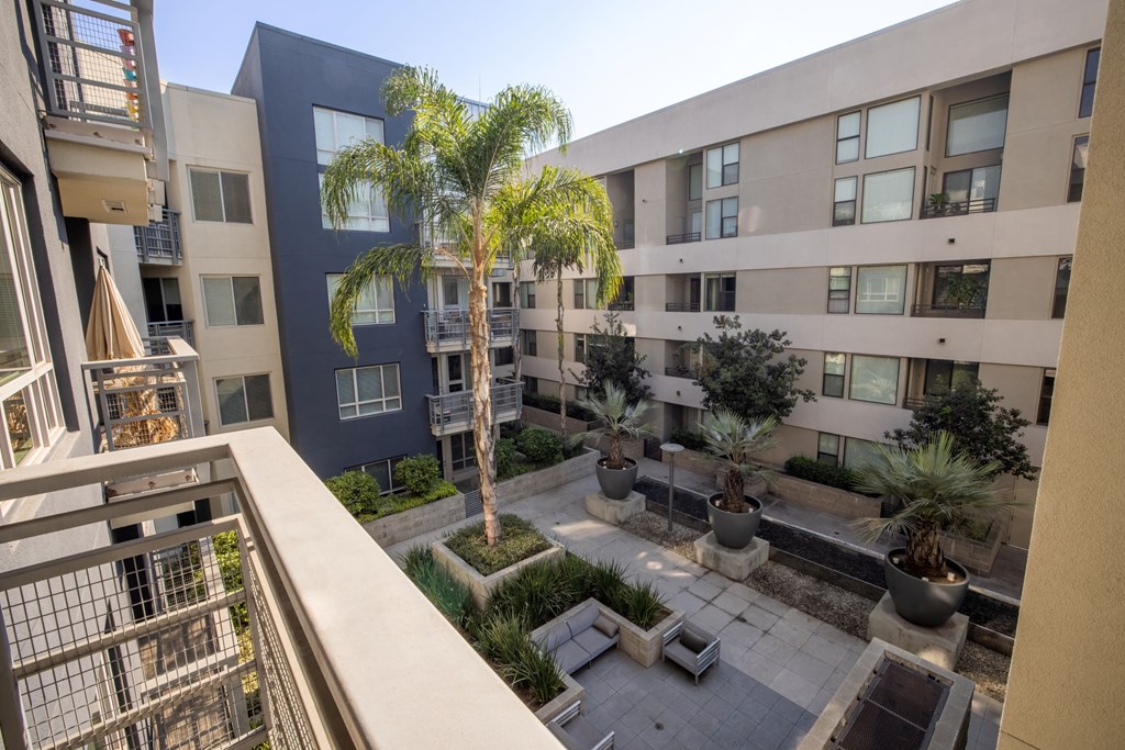 a view of the courtyard from the second floor balcony