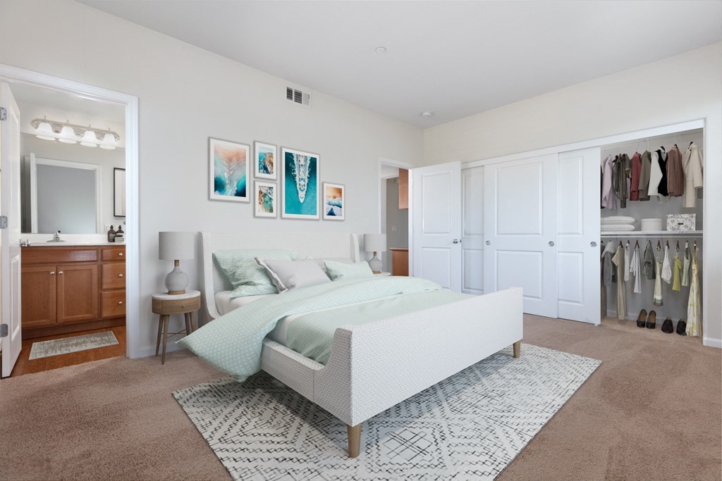 a bedroom with white walls and carpet