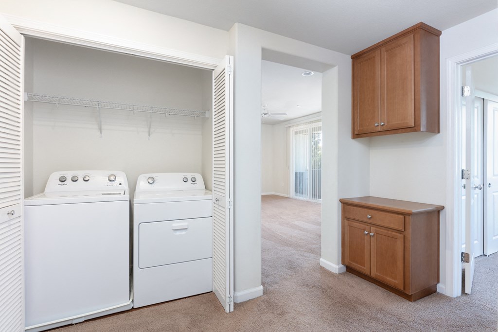 a laundry room with a washer and dryer