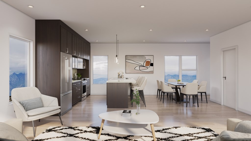 A modern living room with a dining area and kitchen in the background.