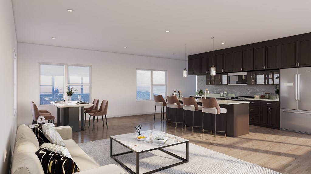 A modern kitchen with a dining table and chairs.