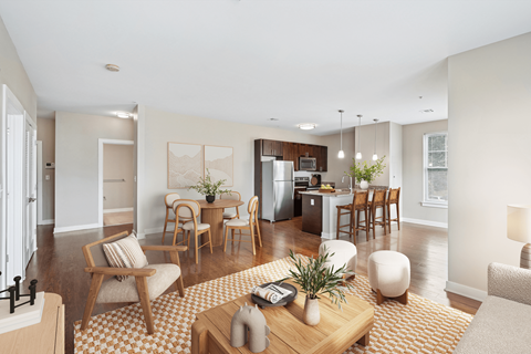 A modern living room with a patterned rug and wooden furniture.
