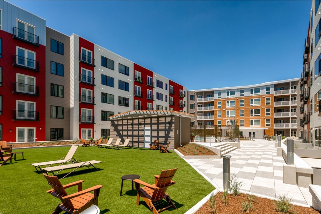 a courtyard with lawn chairs