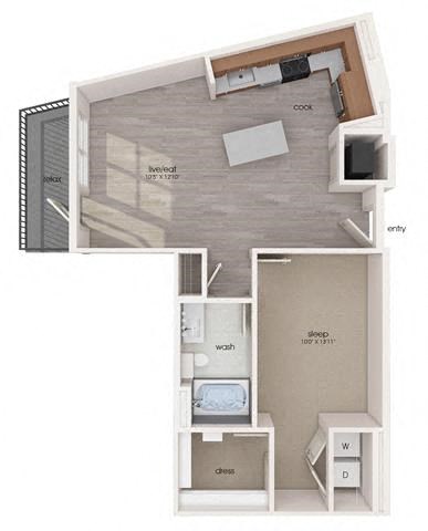 a small room with a desk and a microwave