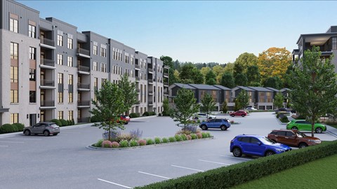 A parking lot with cars and apartment buildings in the background.