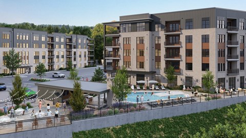 A large apartment complex with a pool and a covered outdoor area.