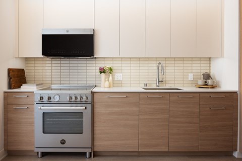 a kitchen with a stove and a sink