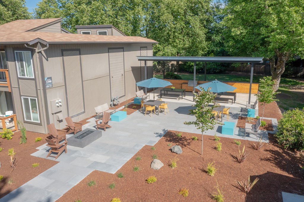 an aerial view of a patio with umbrellas and chairs  at Veri at Timberhill, Corvallis, OR