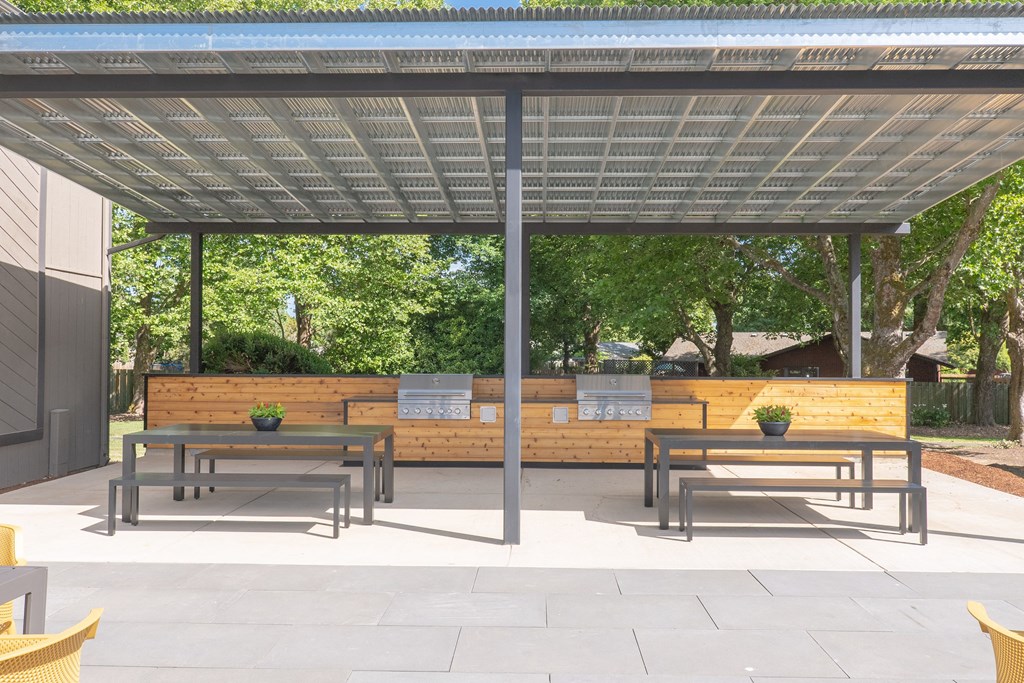 a large pergola with benches and tables under it at Veri at Timberhill, Corvallis, OR