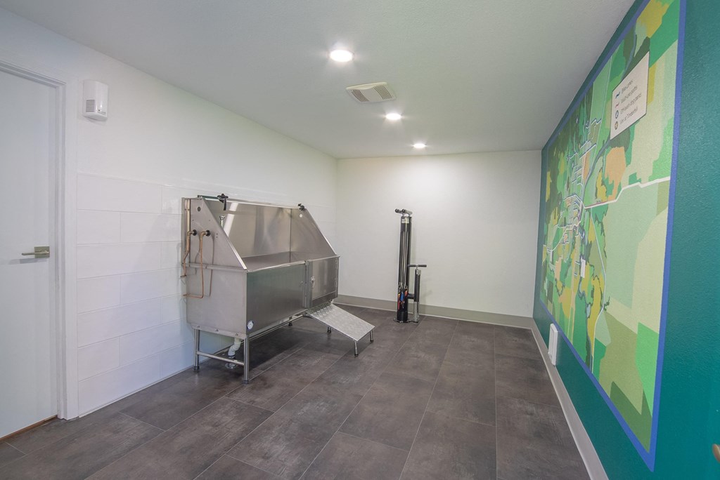 a large stainless steel tub sits in the corner of a room with a large mural on the at Timberhill, Oregon, 97330