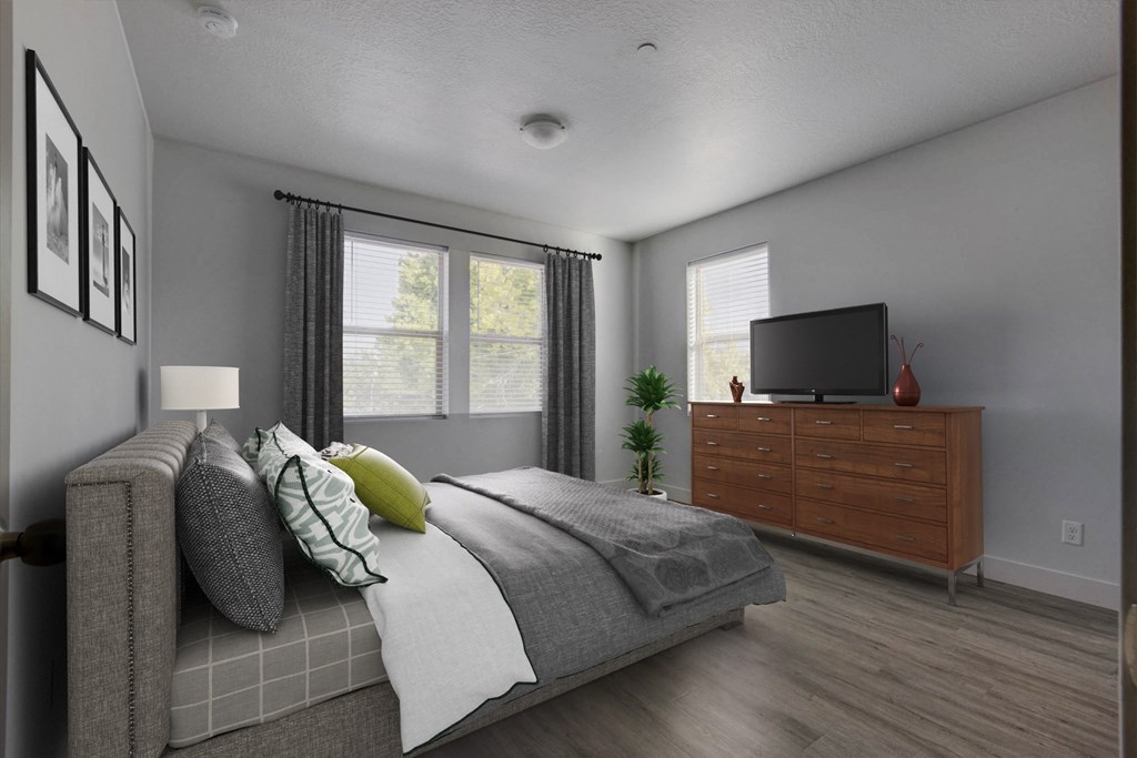 a bedroom with a bed and a dresser