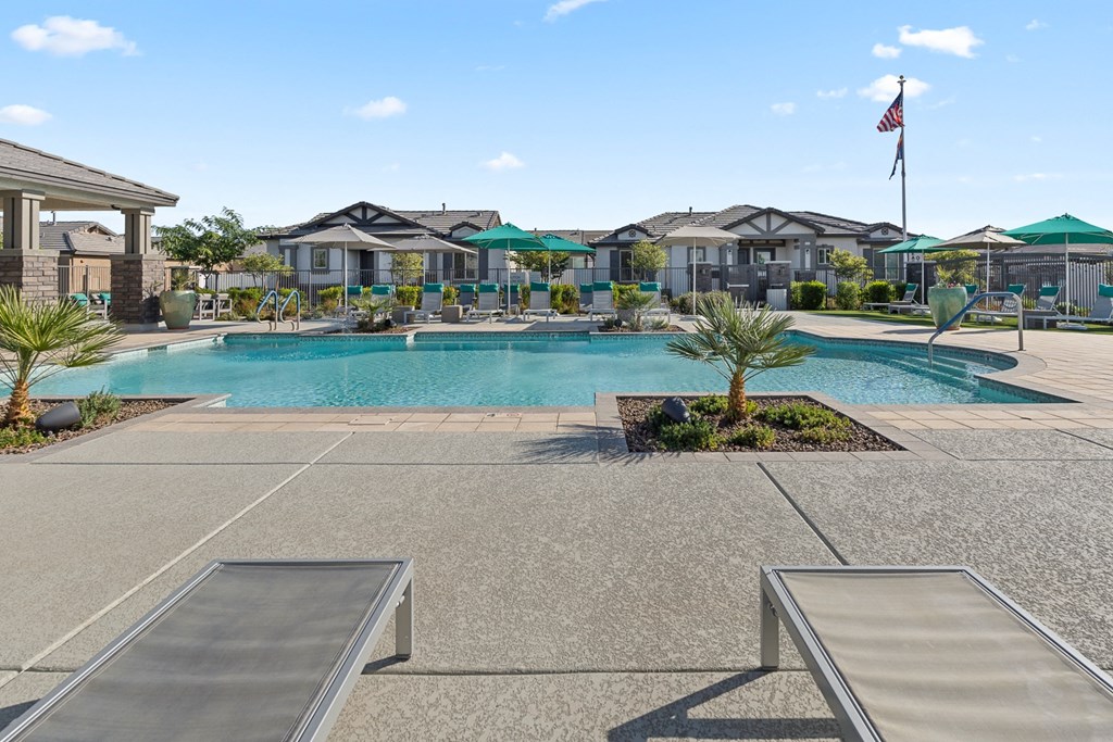 Outdoor resort-style pool with lounge seating