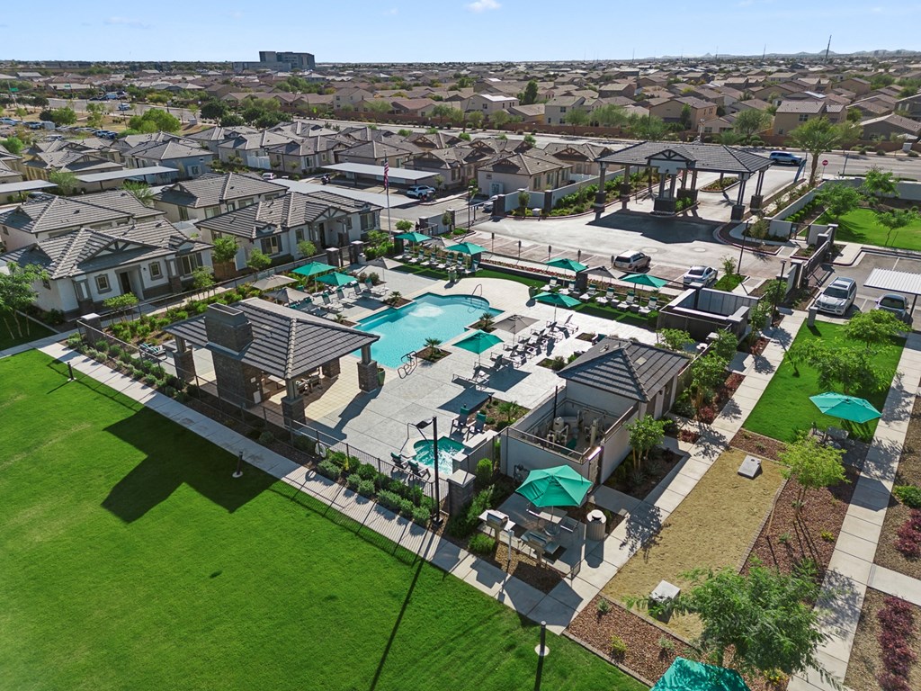 an aerial view of outdoor resort style pool, lounge seating