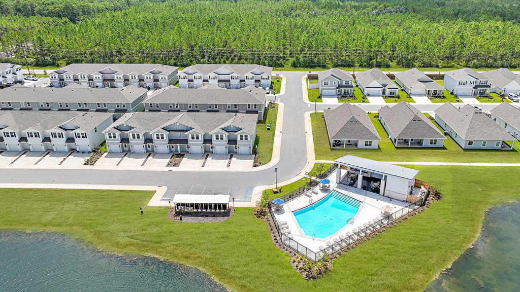 an aerial view of an apartment complex with a swimming pool