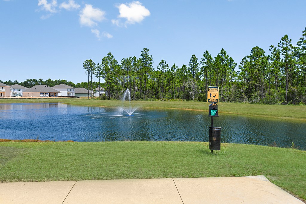 a fountain in the middle of a pond