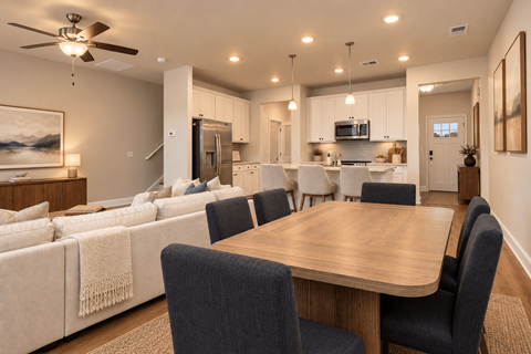 A modern dining room with a wooden table and chairs.