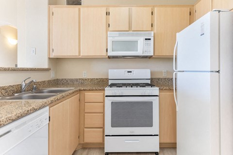 a kitchen with a stove microwave and refrigerator