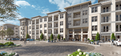 A modern apartment complex with a central courtyard and landscaping.