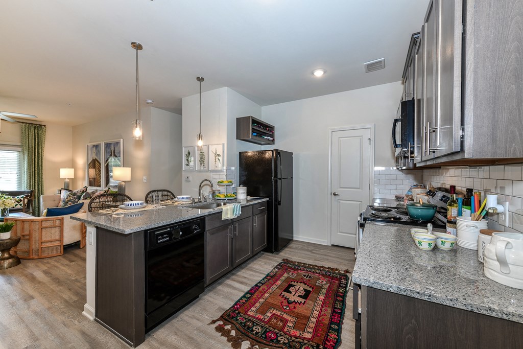 a kitchen with stainless steel appliances and granite counter tops