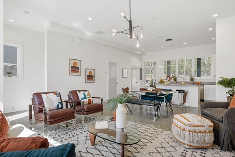 Living room that leads into kitchen open concept layout in our townhomes for rent in East Nashville.