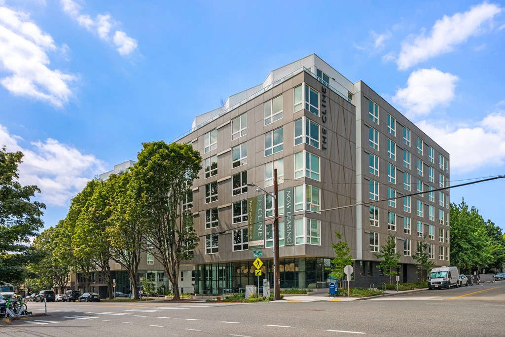 a large building on the corner of a city street