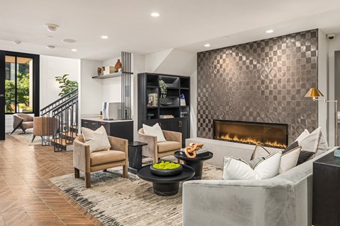 a living room with a fireplace and a rug