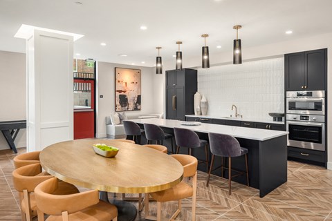 a kitchen and dining area with a wooden table and chairs