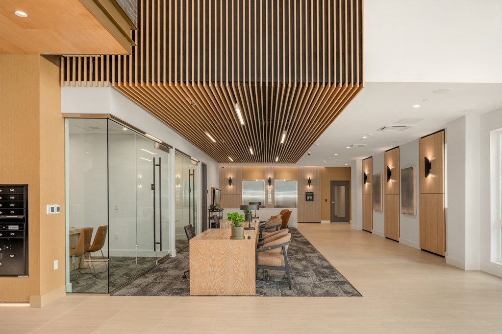 a large lobby with a table and chairs