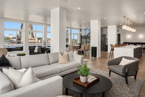 a living room with couches and chairs and a table