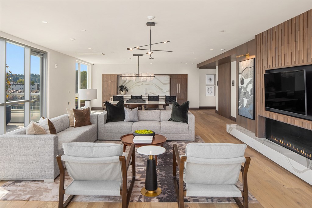 a  living room with couches and chairs and a fireplace