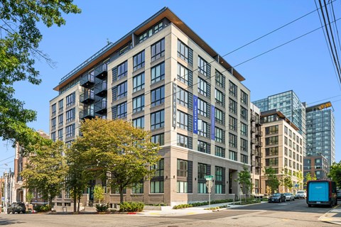 a large building on the corner of a city street
