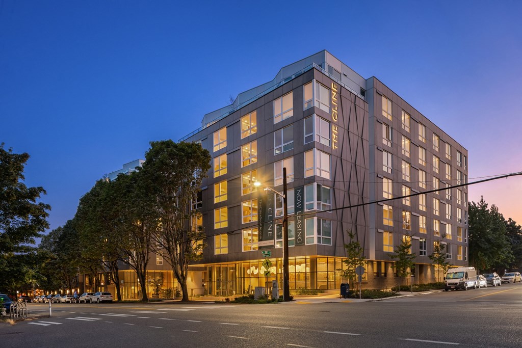 a  large building on a city street at night