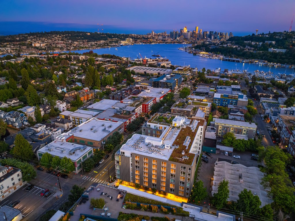 an aerial view of the city at dusk
